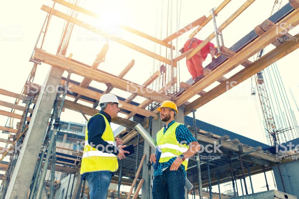 Engineers having meeting regarding new construction phase